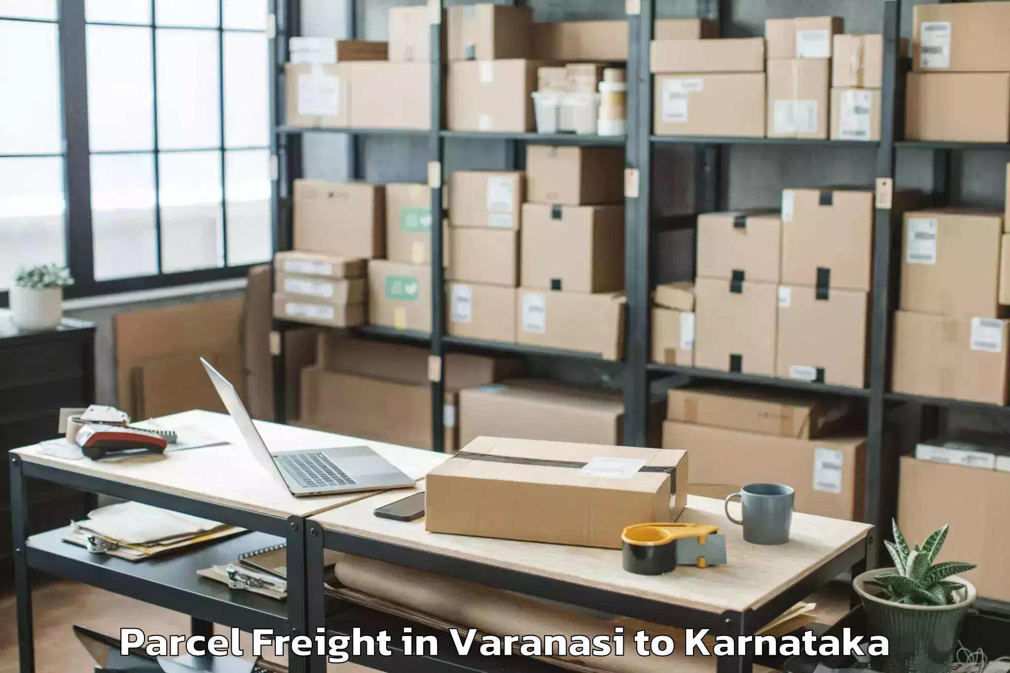 Reliable Varanasi to Karnataka State Law University Parcel Freight